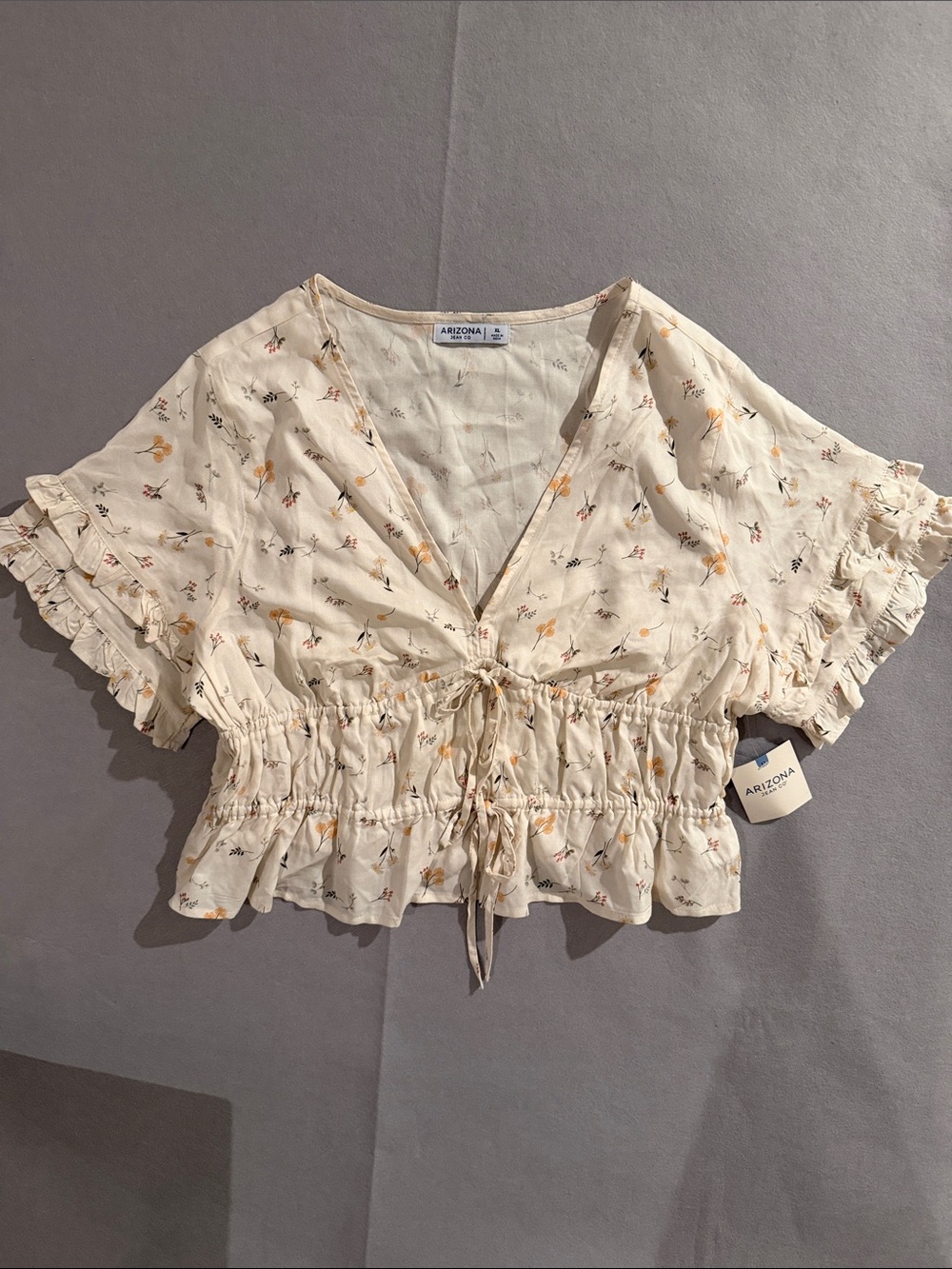 Arizona Jean Company Ivory Wildflower V Neck With Tie Front Ruffle Crop Top